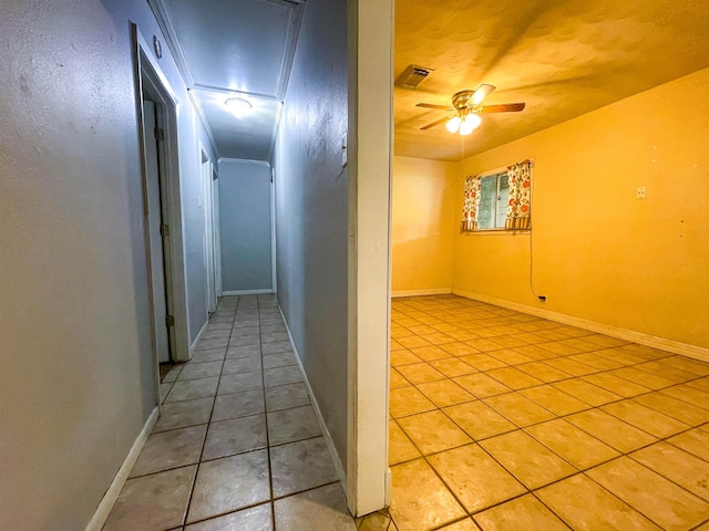 hallway with light tile patterned flooring