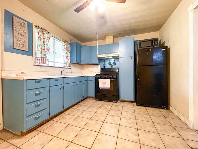 kitchen with blue cabinets, ceiling fan, sink, black appliances, and light tile patterned floors