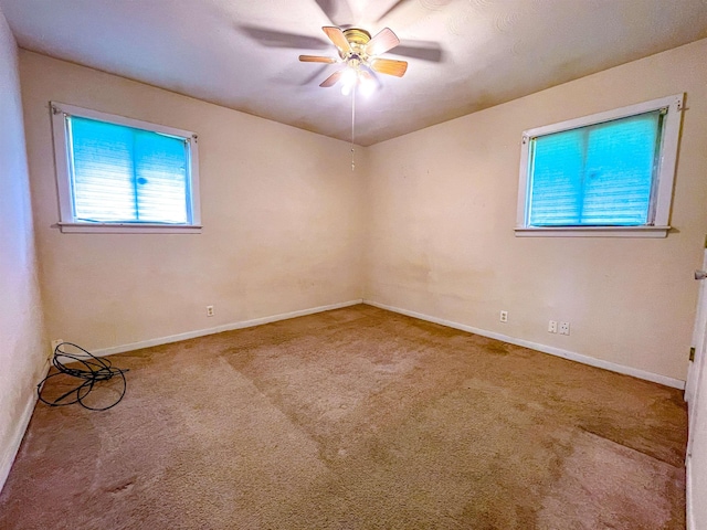 carpeted empty room with ceiling fan