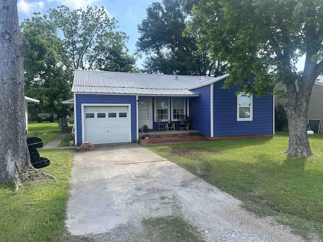 3104 Main Ave, Groves, TX 77619 - ranch-style house with covered porch, a garage, concrete driveway, a front yard, and metal roof