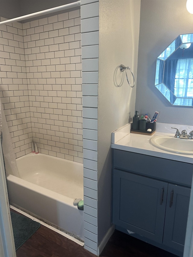 3104 Main Ave, Groves, TX 77619 - full bathroom featuring vanity, shower / bath combination, and wood finished floors