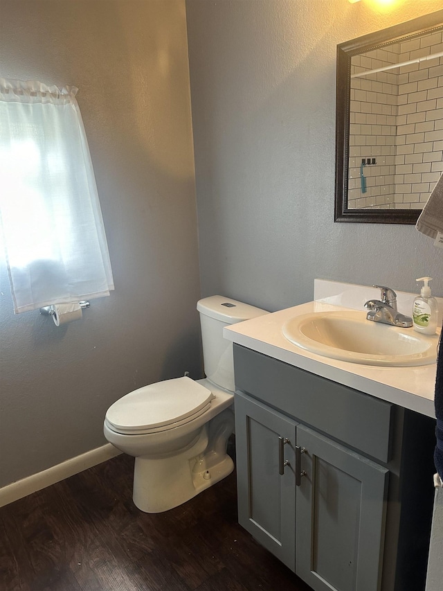 3104 Main Ave, Groves, TX 77619 - bathroom featuring toilet, wood finished floors, and vanity