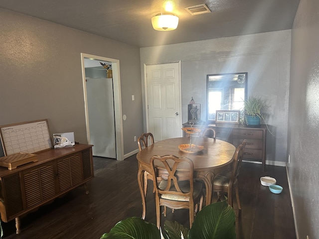 3104 Main Ave, Groves, TX 77619 - dining area featuring wood finished floors, a desk, and baseboards