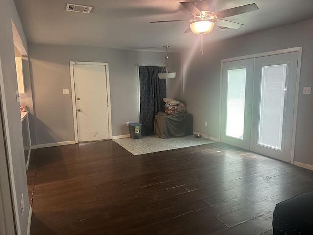 3104 Main Ave, Groves, TX 77619 - unfurnished living room with wood-type flooring, ceiling fan, and baseboards