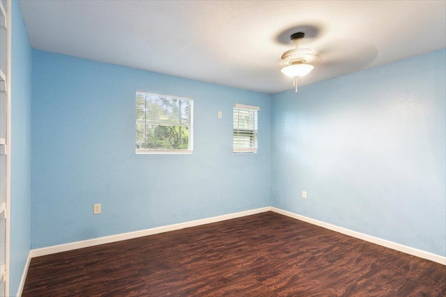 spare room with hardwood / wood-style flooring and ceiling fan