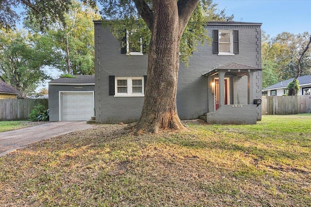 view of front of home featuring a garage and a front lawn