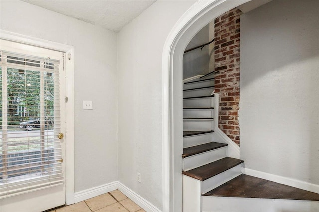 interior space featuring light tile patterned floors and a healthy amount of sunlight