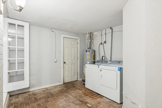 laundry room with gas water heater, independent washer and dryer, and a textured ceiling