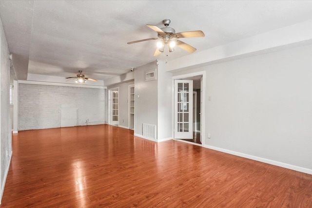 unfurnished room featuring hardwood / wood-style floors and ceiling fan