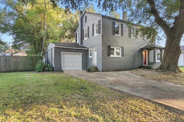 view of front of house with a garage and a front yard