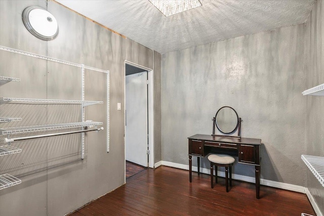 office space with dark wood-type flooring