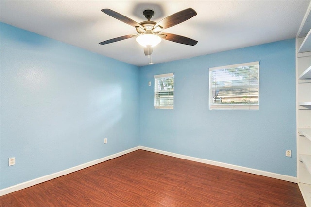 empty room featuring ceiling fan and hardwood / wood-style flooring