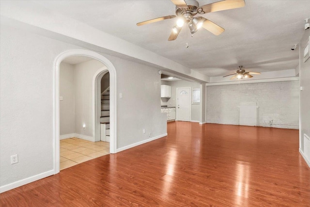 spare room featuring light hardwood / wood-style flooring and ceiling fan