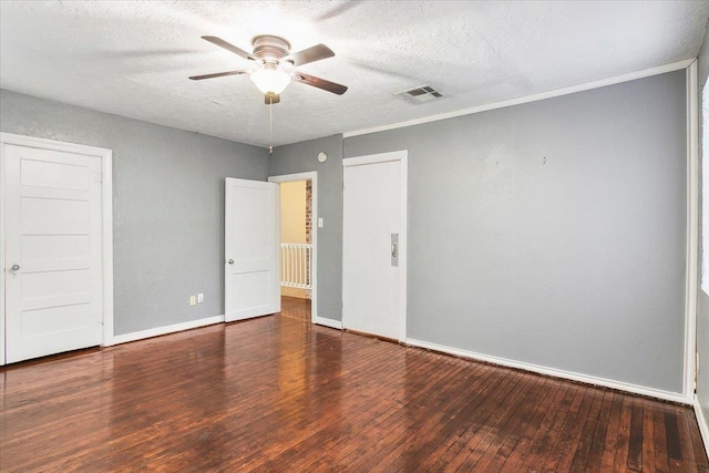 unfurnished bedroom featuring ceiling fan, dark hardwood / wood-style flooring, and a textured ceiling