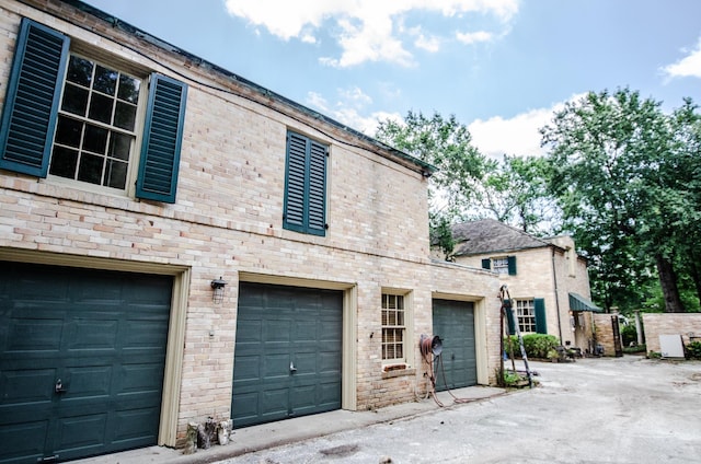 view of side of property featuring a garage