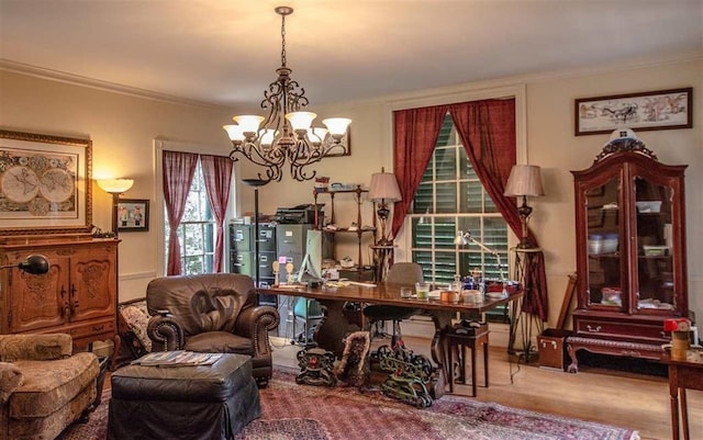 office area featuring an inviting chandelier and ornamental molding