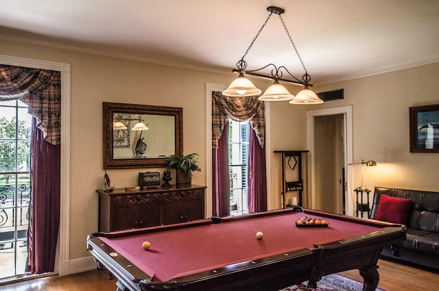 playroom with hardwood / wood-style floors, ornamental molding, and pool table