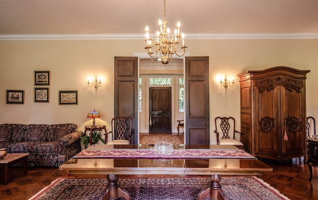 foyer entrance with dark parquet flooring, ornamental molding, and a chandelier