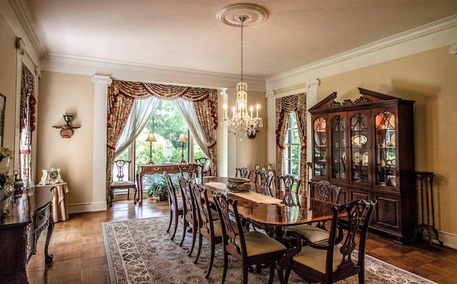 dining room featuring parquet floors, crown molding, and an inviting chandelier