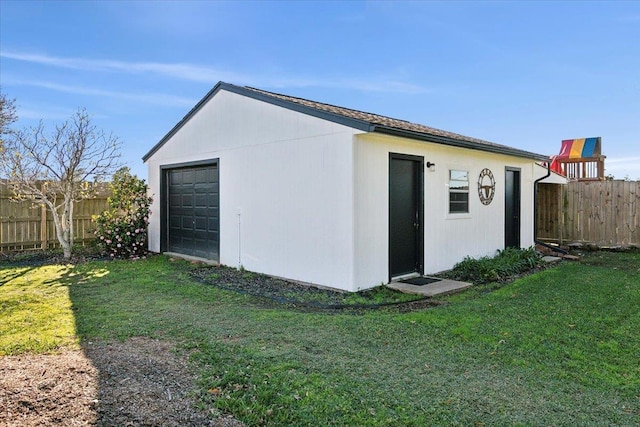 exterior space featuring a lawn and an outdoor structure