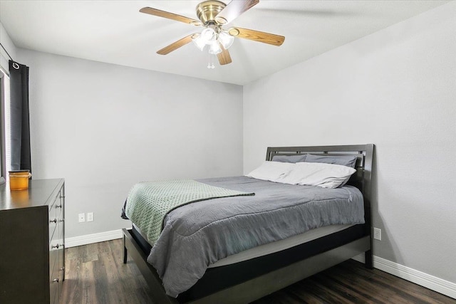 bedroom with dark hardwood / wood-style floors and ceiling fan