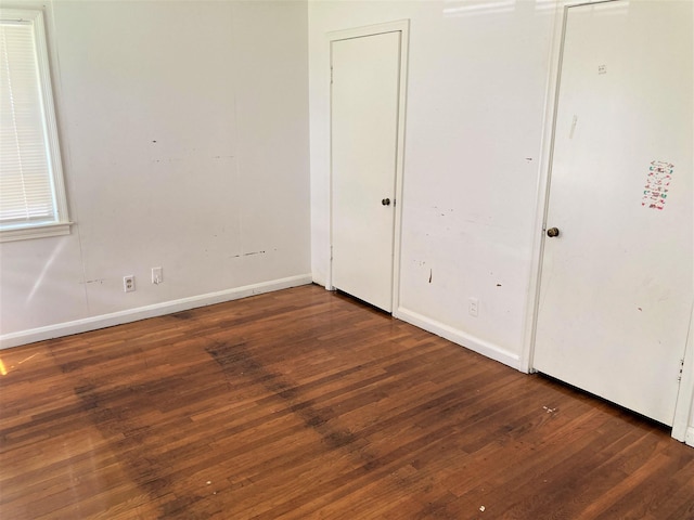 4701 Redbird St, Port Arthur, TX 77642 - unfurnished bedroom with wood finished floors and baseboards