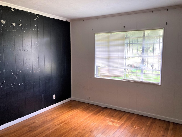 4701 Redbird St, Port Arthur, TX 77642 - spare room featuring wood-type flooring, baseboards, and ornamental molding