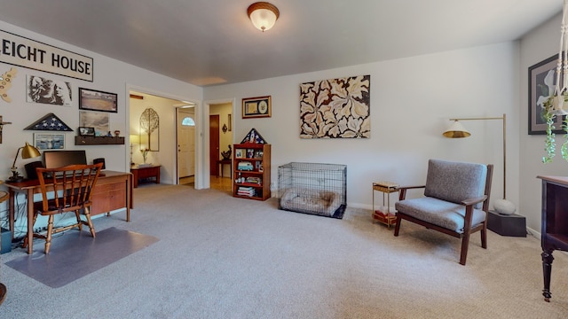 carpeted office space featuring baseboards