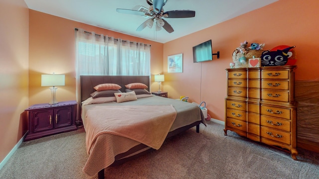 bedroom featuring carpet flooring, a ceiling fan, and baseboards