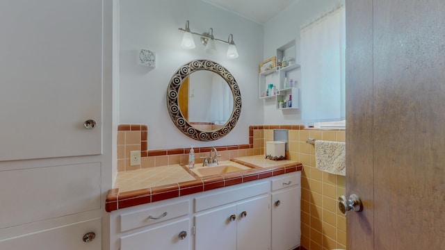 bathroom featuring vanity and tile walls