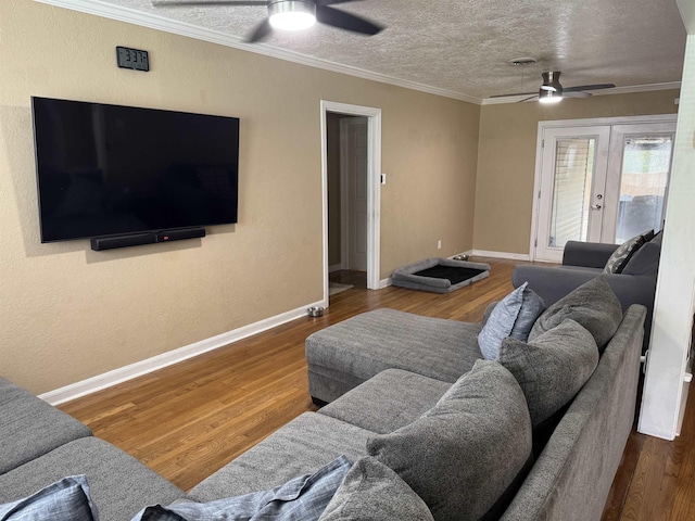 3720 Austin St, Beaumont, TX 77706 - living area featuring ceiling fan, french doors, baseboards, wood finished floors, and crown molding