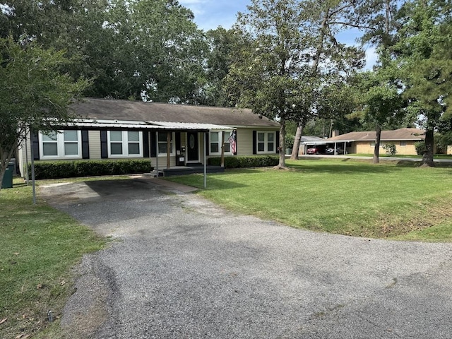 3720 Austin St, Beaumont, TX 77706 - ranch-style house featuring a front yard and driveway