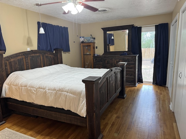 3720 Austin St, Beaumont, TX 77706 - bedroom featuring a textured ceiling, wood finished floors, access to outside, and a ceiling fan