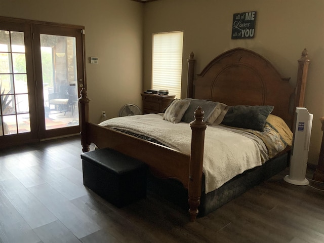 bedroom featuring access to exterior and wood-type flooring