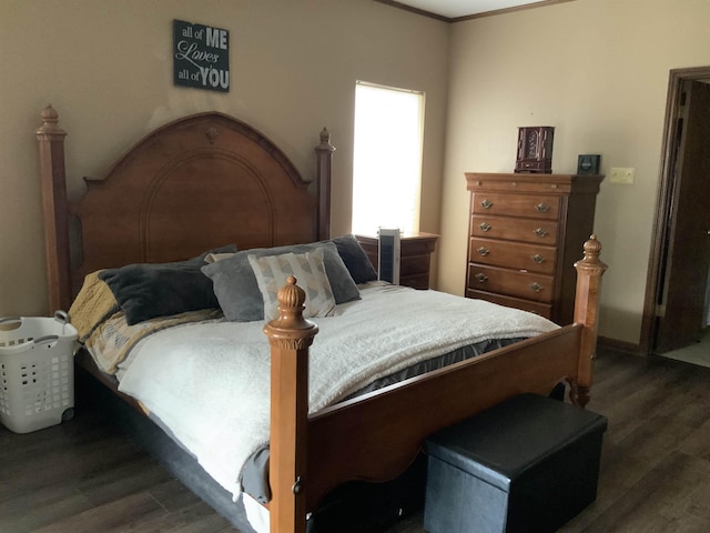 bedroom featuring dark hardwood / wood-style flooring and ornamental molding