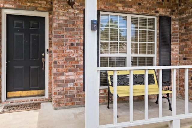 7845 Indian Blanket Dr, Beaumont, TX 77713 - property entrance with brick siding and a porch