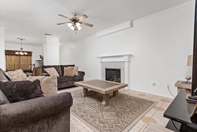 7845 Indian Blanket Dr, Beaumont, TX 77713 - living area featuring ceiling fan, crown molding, a chandelier, a tiled fireplace, and baseboards