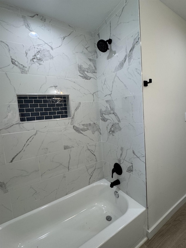3022 S Drive, Groves, TX 77619 - bathroom featuring shower / washtub combination and baseboards