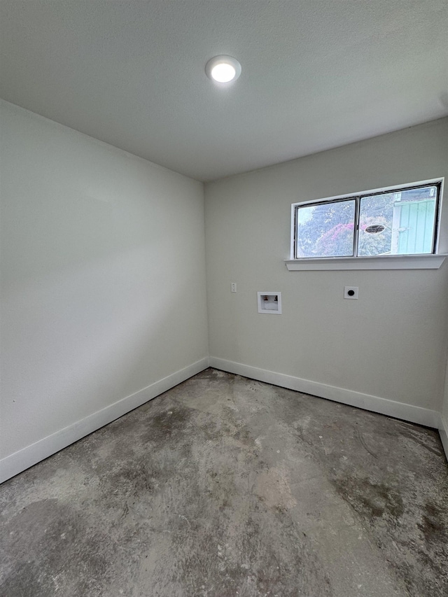 3022 S Drive, Groves, TX 77619 - spare room featuring unfinished concrete flooring and baseboards