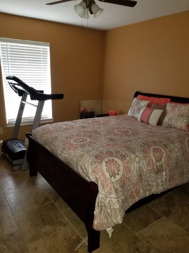 3215 Lancelot St, Orange, TX 77630 - bedroom with tile patterned flooring and a ceiling fan