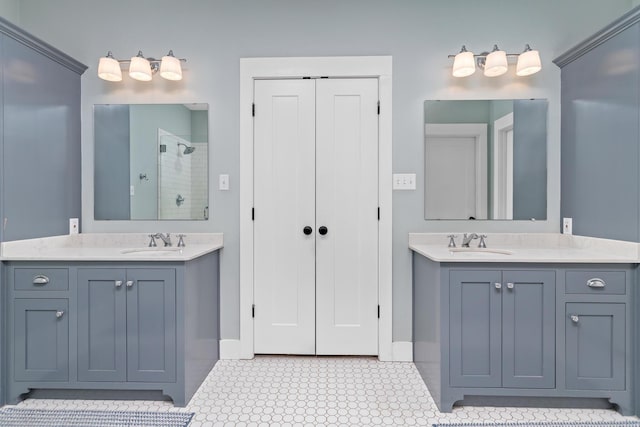 bathroom with walk in shower and vanity