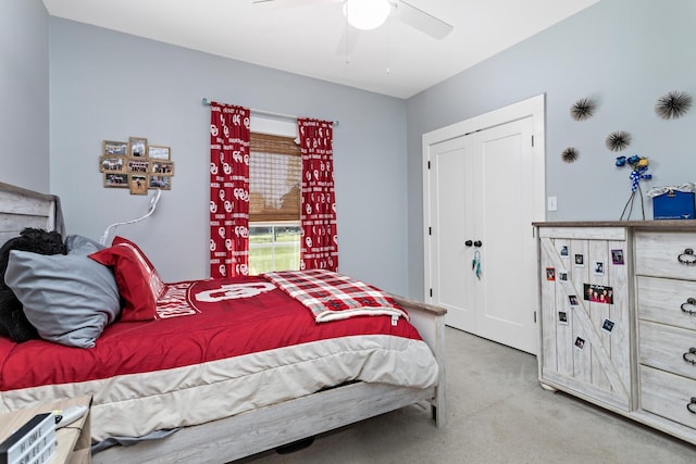 bedroom featuring light colored carpet and ceiling fan