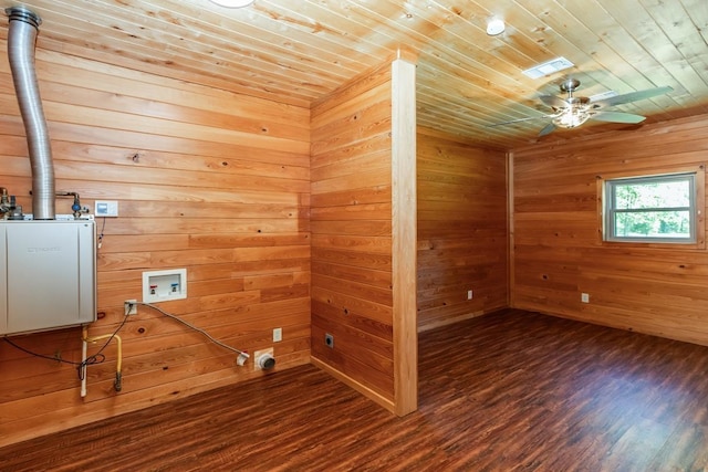 1905 Villa Rd, Kountze, TX 77625 - spare room featuring wooden ceiling, wood finished floors, ceiling fan, and wood walls