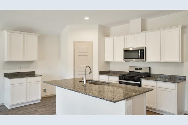 kitchen with sink, white cabinets, and stainless steel appliances