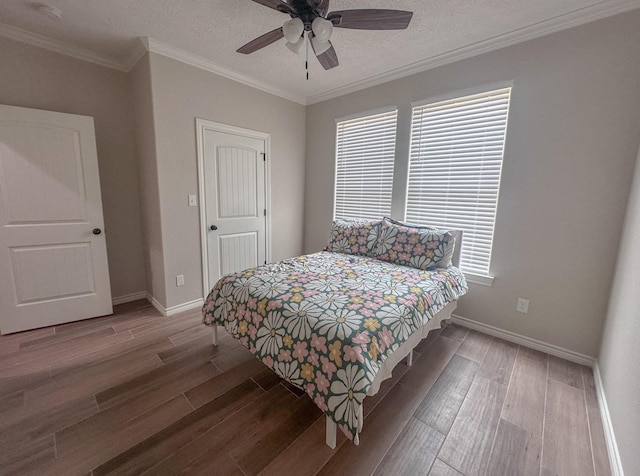 308 Long Leaf St, Silsbee, TX 77656 - bedroom with wood finished floors, baseboards, crown molding, ceiling fan, and a textured ceiling