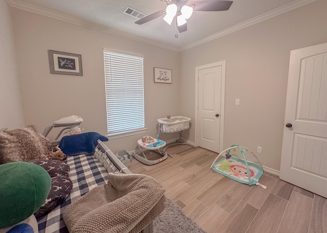 308 Long Leaf St, Silsbee, TX 77656 - recreation room featuring ornamental molding, a ceiling fan, light wood-style floors, and baseboards