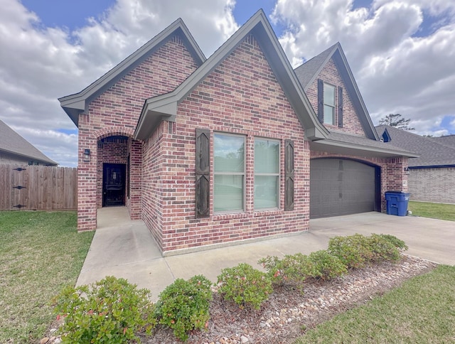 308 Long Leaf St, Silsbee, TX 77656 - view of front facade with brick siding, concrete driveway, and a garage