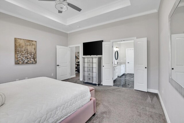 3435 Grey Hawk, Beaumont, TX 77707 - carpeted bedroom featuring crown molding, a raised ceiling, baseboards, ensuite bath, and a ceiling fan