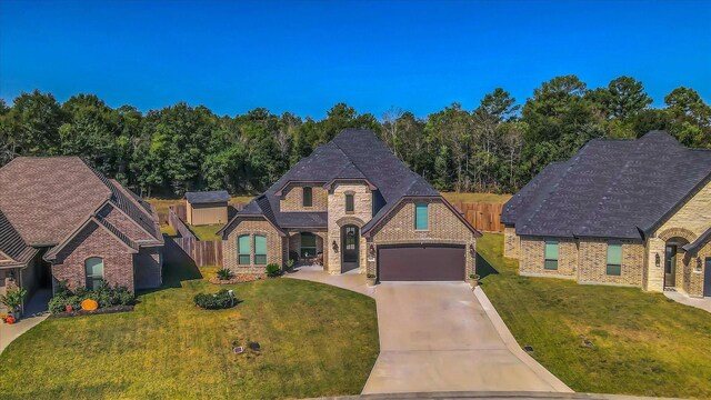 3435 Grey Hawk, Beaumont, TX 77707 - french country inspired facade with driveway and brick siding