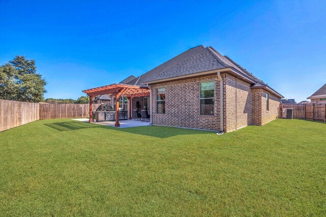 3435 Grey Hawk, Beaumont, TX 77707 - back of house featuring brick siding, a shingled roof, a pergola, a patio, and central AC